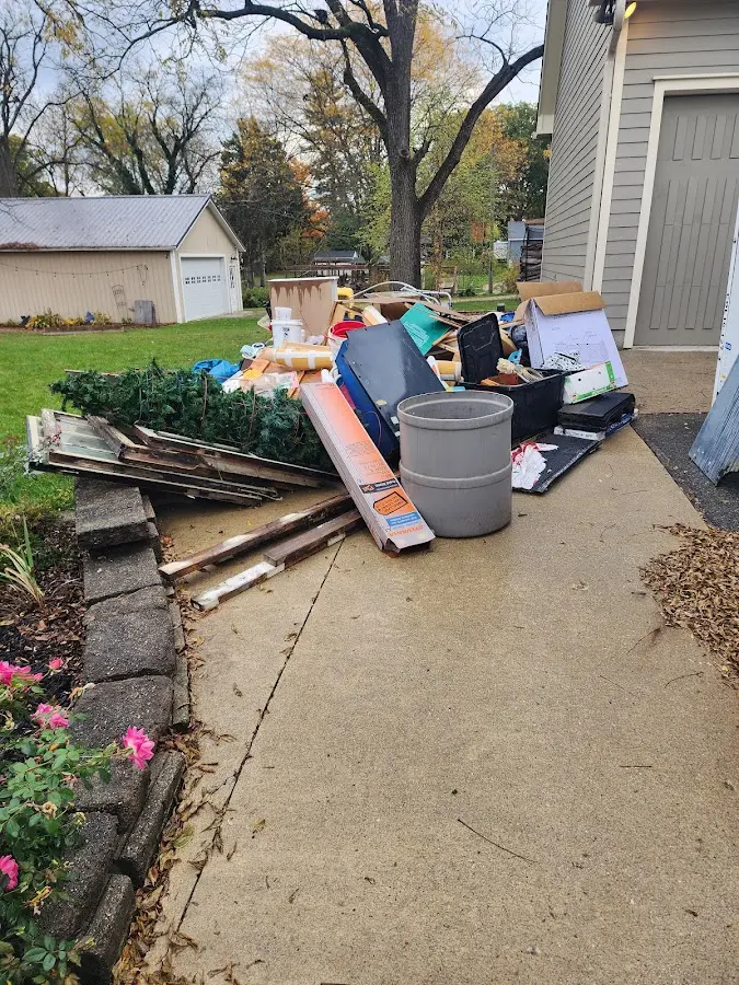 Dumpster being loaded with debris for Estate Cleanout Dumpster Rental in Ebensburg
